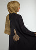 This simple yet elegant abaya features embroidery on the back and cuffs. Inspired by Islamic Art of Calligraphy. 'Celi' Is the name of a pen used for large forms of calligraphy. Black.