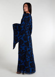 Elevate your evening and garden party attire with the striking Midnight Rose Kaftan, featuring a bold black and blue rose print. Designed with fully lined, dramatic pointed wide sleeves, this kaftan is perfect for special occasions. 