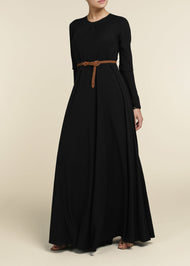 Black colour. Cut in 100% cotton jersey with a fitted bodice & voluminous drop. Styling details include a round neckline with subtle pleats. Features button fastenings on the back & sleeve cuffs.&nbsp;