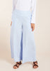 The Sky Blue Co-Ord Set features a light cotton feel and includes loose fit flared trousers paired with a long shirt. This versatile set allows for both open and closed styling, making it the perfect outfit for summer. To ensure a seamless look, we recommend wearing nude undergarments or a vest underneath, as light cotton fabrics tend to be sheer.