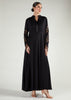 Woman wearing a black abaya with floral embroidery on sleeves against a white background